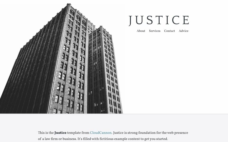 Screenshot of Justice theme layout of the front page with a heading and menu on the top right ontop of a simple black and white picture of a building
