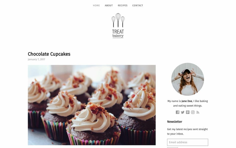 Screenshot of Treat theme layout of the front page containing a menu along the top of the page, a blog post card on the left with a big picture of a cupcake and on the right a component containg contact info and profile picture